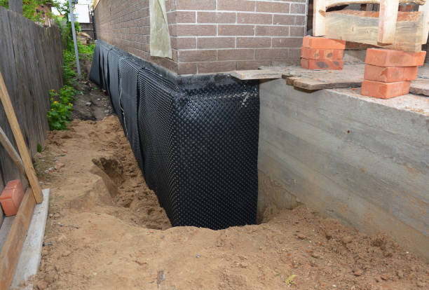 Happy homeowners after waterproofing job in Wausau